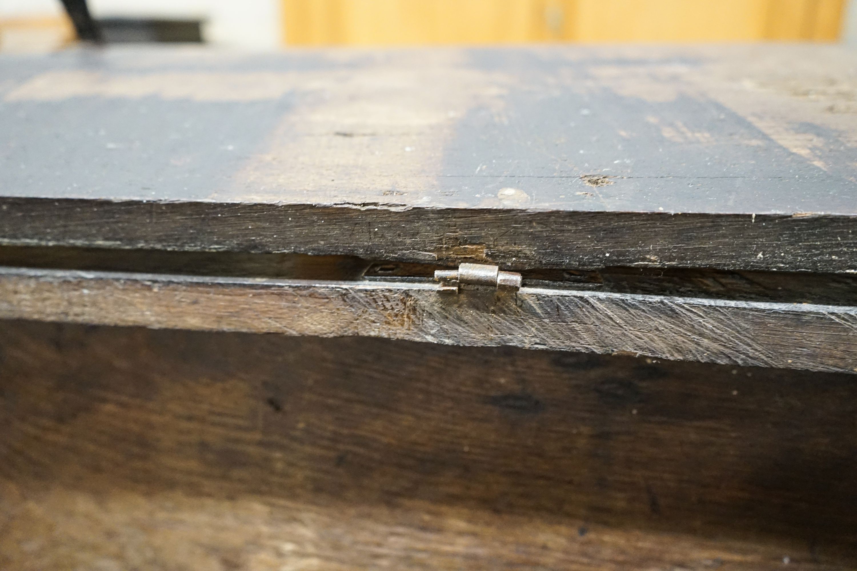 A 17th century oak and elm six plank coffer, width 104cm, depth 36cm, height 54cm